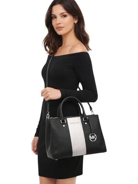 Michael Kors structured satchel in black with a central silver stripe. EUC